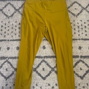 Athleta Mustard Yellow Ultimate stash Pocket 7/8 Leggings